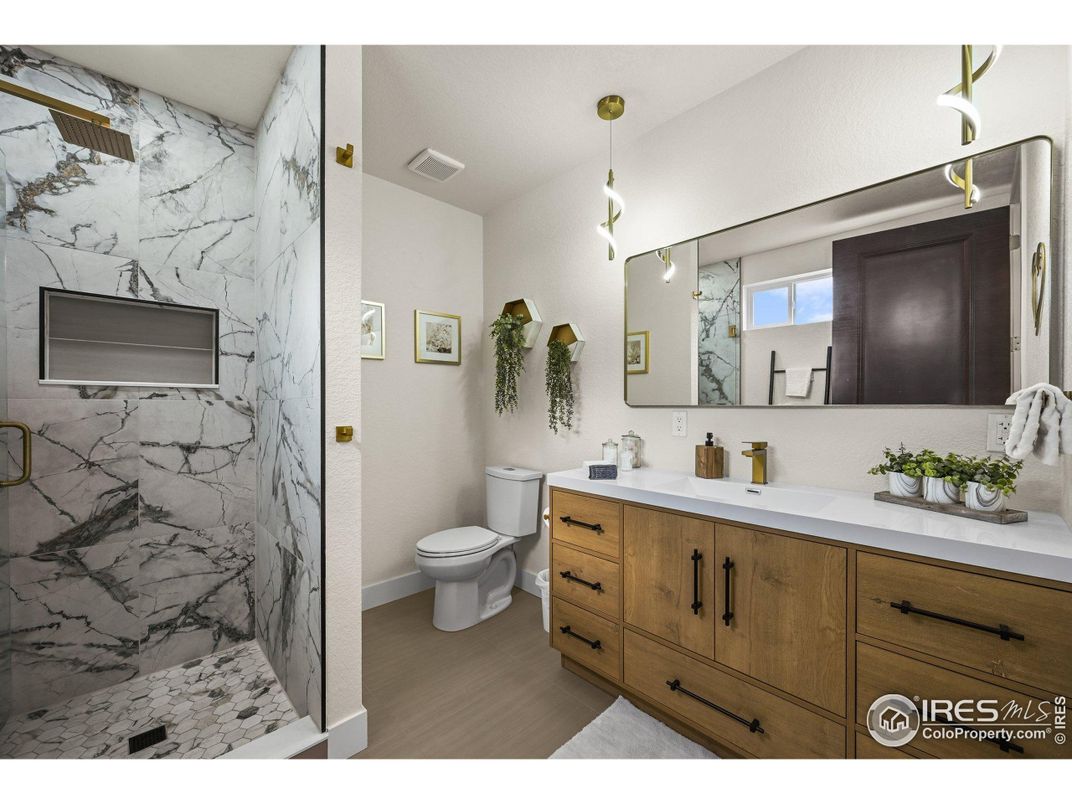 Bathroom, Dual Sink Vanities, Interior, Marble Walls, Pendant Lights, Wood Texture Flooring
