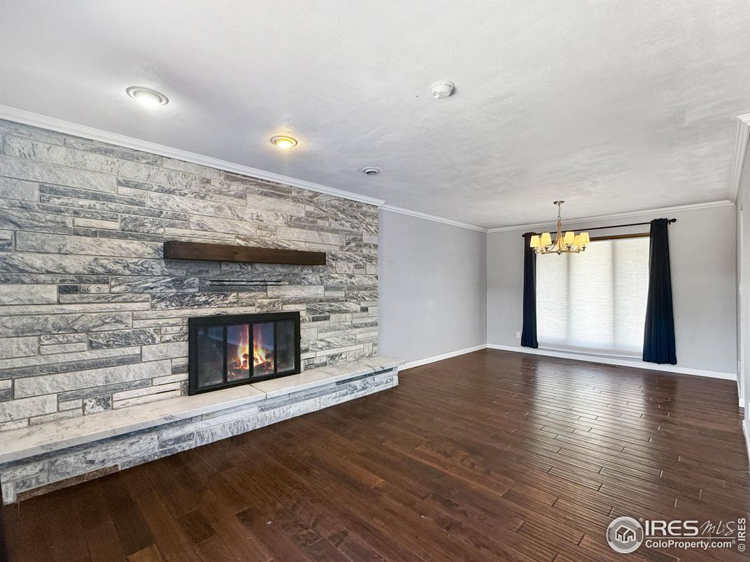 Chandelier, Empty room, Fireplace, Interior, Recessed Lighting, Wood Texture Flooring
