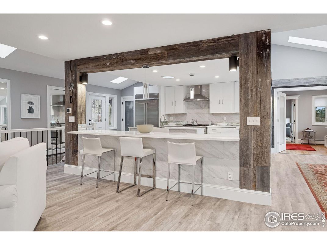 Interior, Kitchen, Marble Walls, Pendant Lights, Recessed Lighting, Stainless Steel Appliances, Wood Texture Flooring