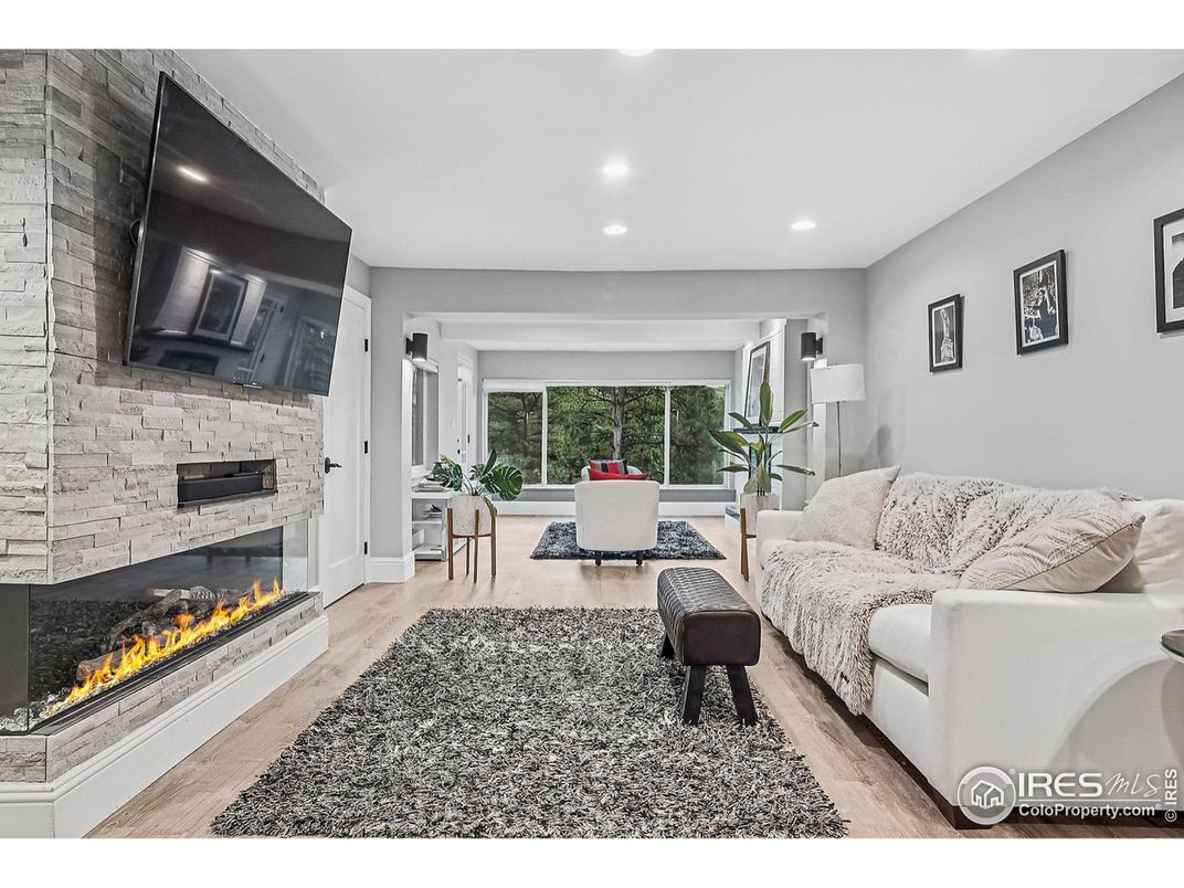 Fireplace, Interior, Living room, Recessed Lighting, Stone Walls, Wood Texture Flooring