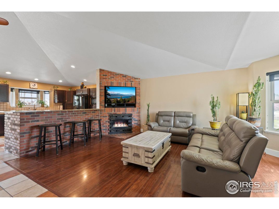 Dining room, Fireplace, Interior, Kitchen, Living room, Recessed Lighting, Stone Walls, Wood Texture Flooring
