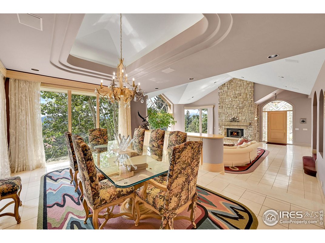 Chandelier, Dining room, Fireplace, Interior, Living room, Pendant Lights, Recessed Lighting, Stone Walls