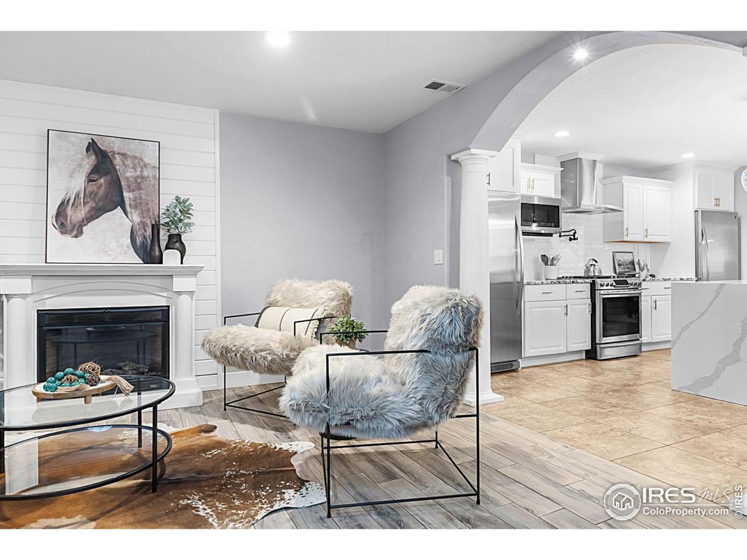 Fireplace, Interior, Kitchen, Recessed Lighting, Stainless Steel Appliances, Wood Texture Flooring