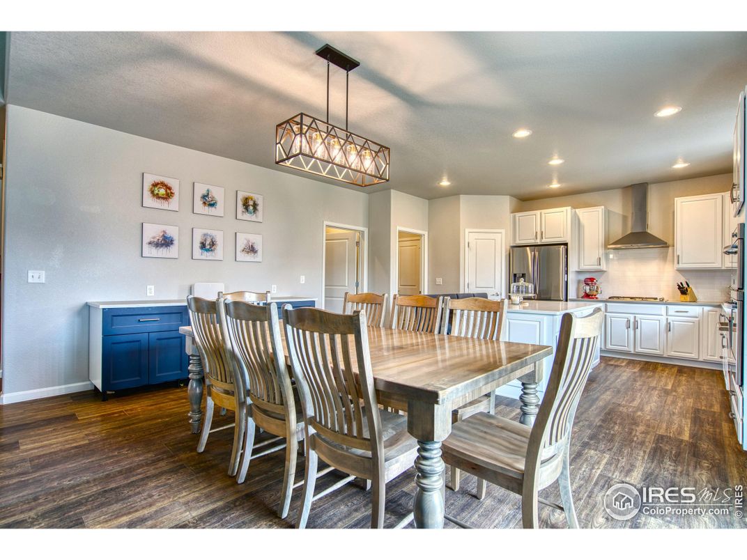 Dining room, Interior, Kitchen, Pendant Lights, Recessed Lighting, Stainless Steel Appliances, Wood Texture Flooring