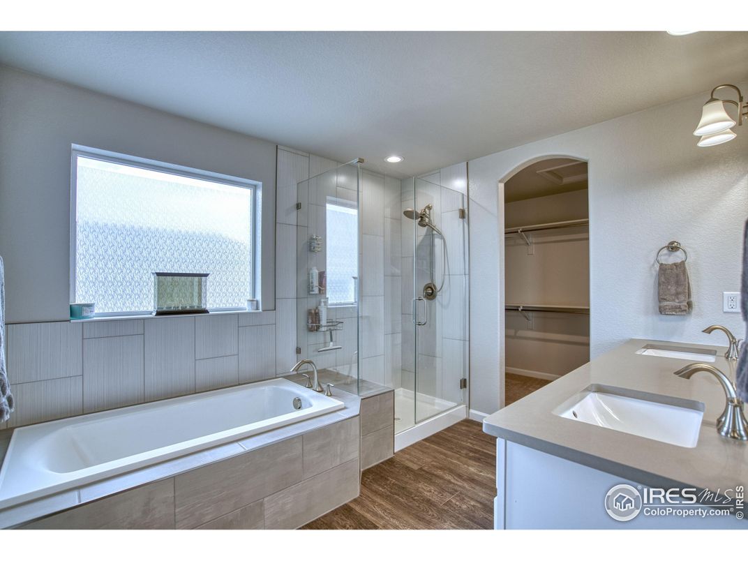 Bathroom, Dual Sink Vanities, Glass Shower, Interior, Recessed Lighting, Wood Texture Flooring