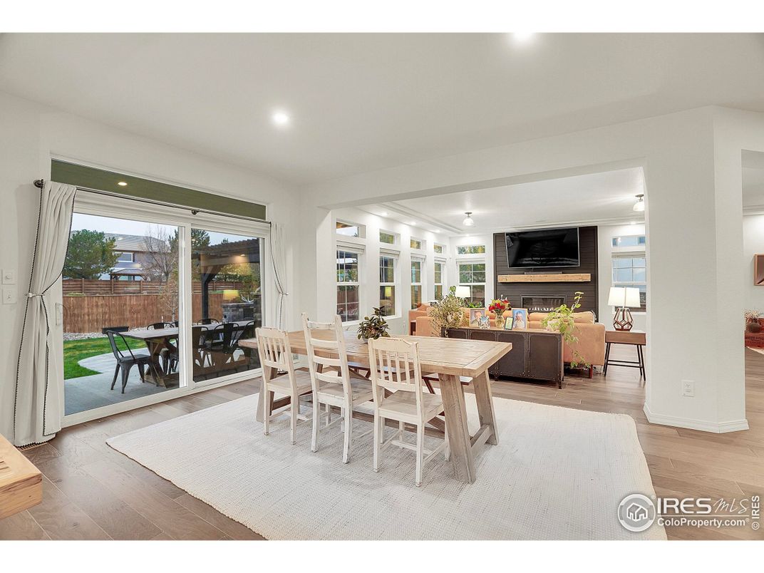 Dining room, Fireplace, Interior, Living room, Recessed Lighting, Wood Texture Flooring