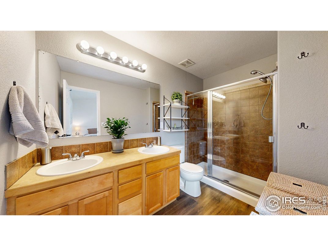 Bathroom, Dual Sink Vanities, Glass Shower, Interior, Wood Texture Flooring