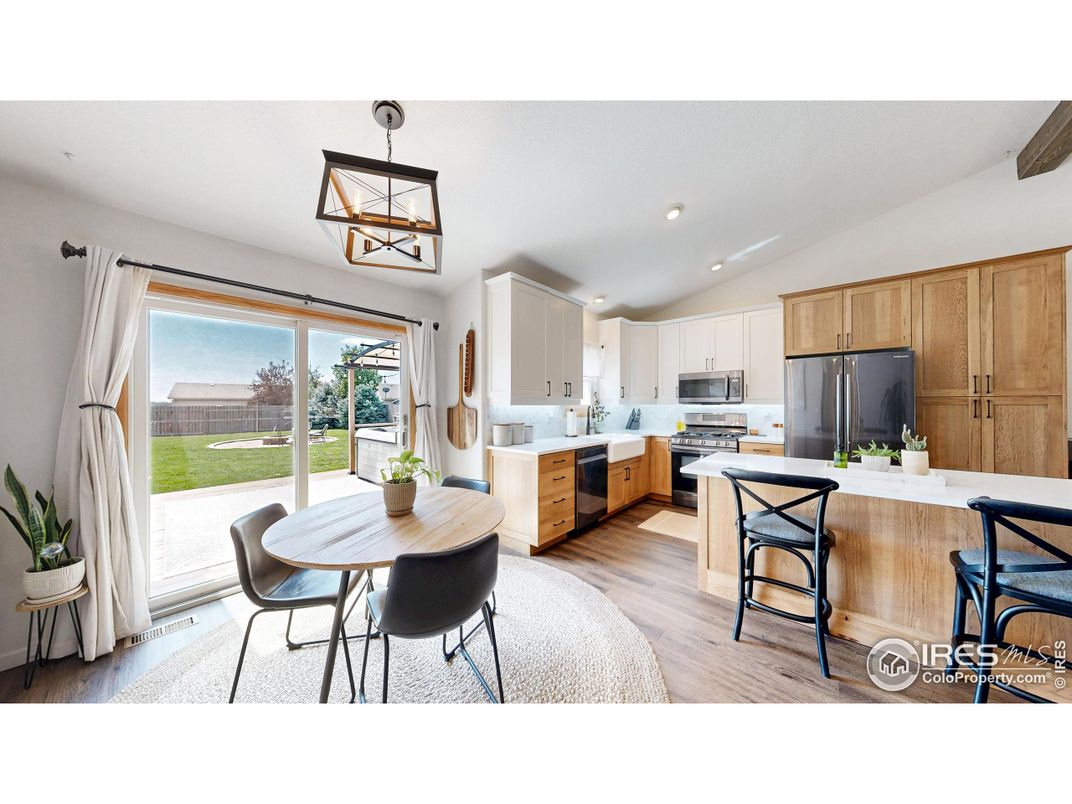 Dining room, Interior, Kitchen, Pendant Lights, Recessed Lighting, Stainless Steel Appliances, Wood Texture Flooring