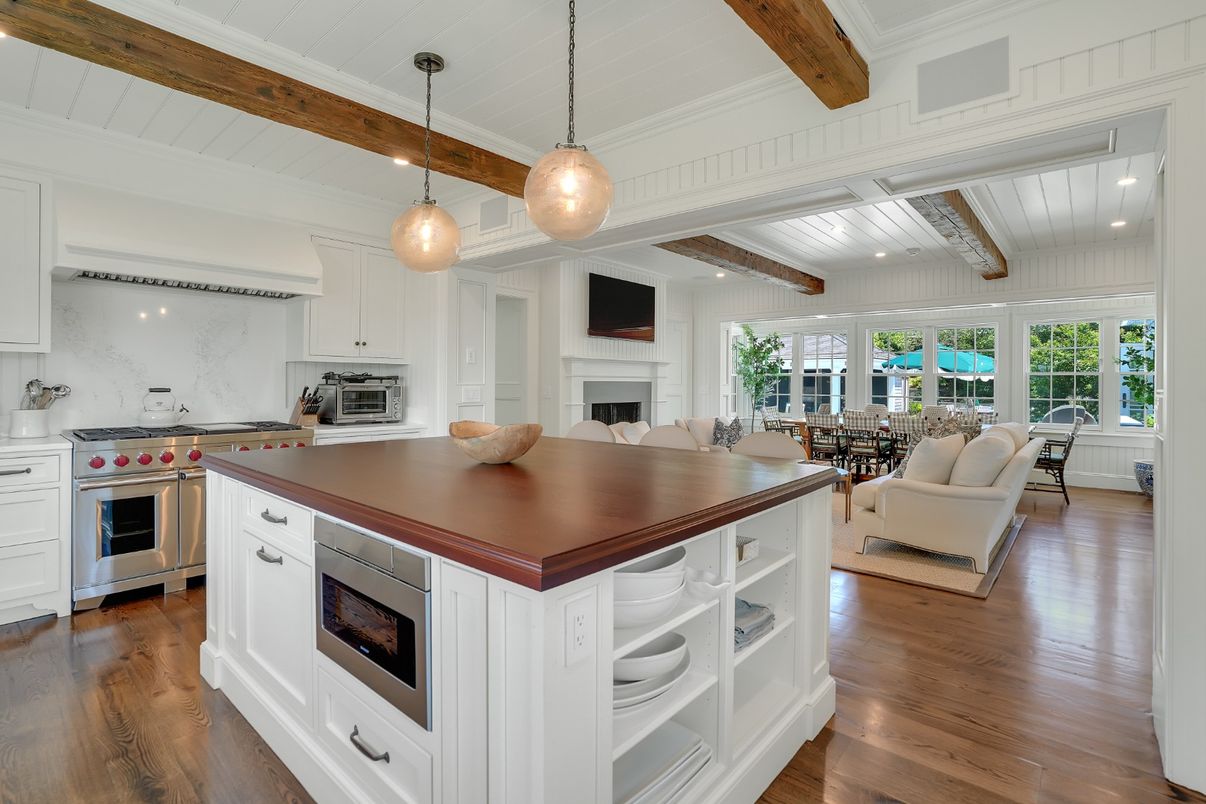 Fireplace, Interior, Kitchen, Living room, Pendant Lights, Recessed Lighting, Stainless Steel Appliances, Wooden Beams, Wood Texture Flooring