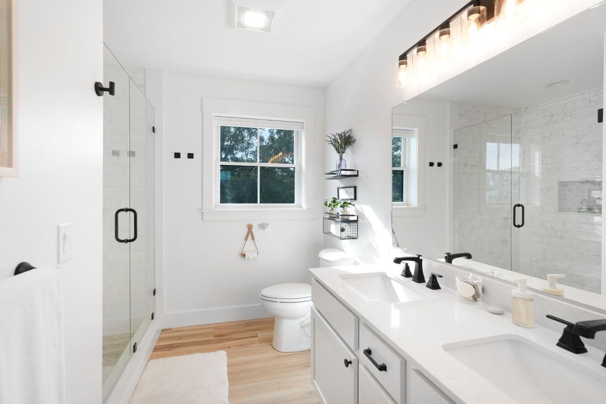 Bathroom, Dual Sink Vanities, Glass Shower, Interior, Marble Walls, Wood Texture Flooring