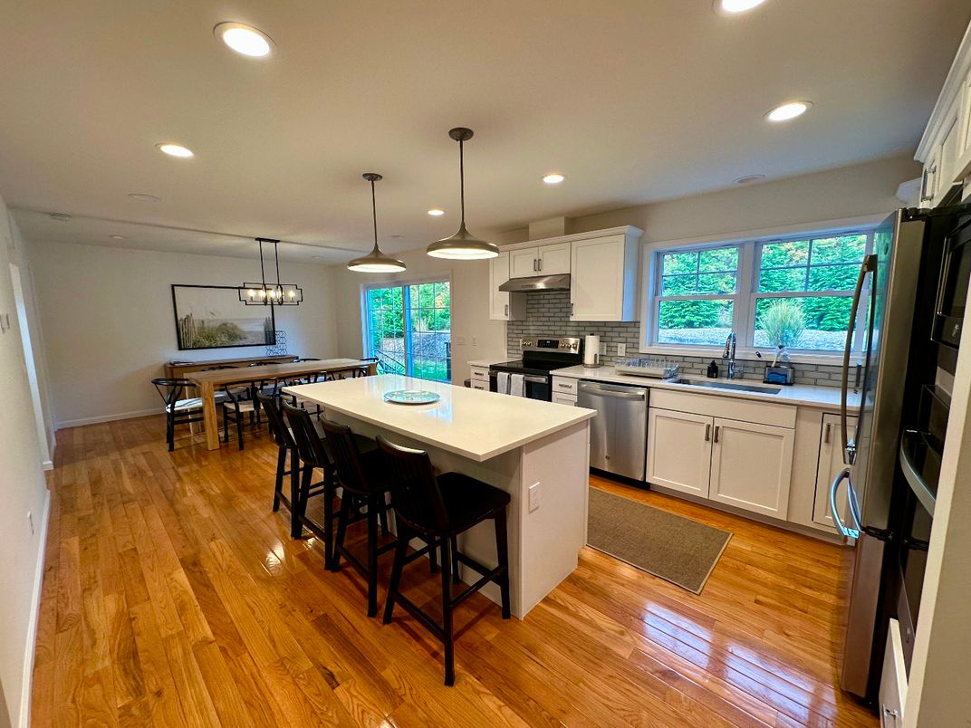 Dining room, Interior, Kitchen, Pendant Lights, Recessed Lighting, Stainless Steel Appliances, Wood Texture Flooring