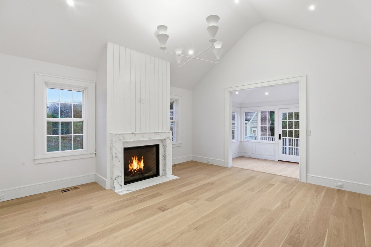 Chandelier, Empty room, Fireplace, Interior, Recessed Lighting, Wood Texture Flooring