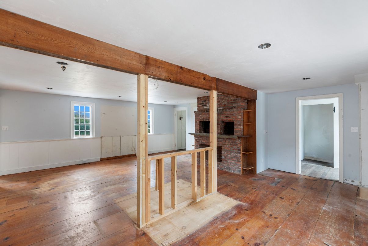 Empty room, Fireplace, Interior, Recessed Lighting, Stone Walls, Wooden Beams, Wood Texture Flooring