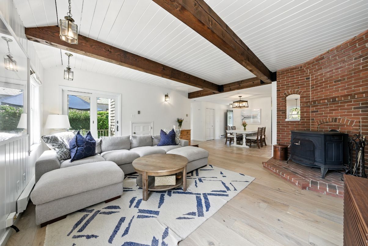 Dining room, Fireplace, Interior, Living room, Pendant Lights, Stone Walls, Wooden Beams, Wood Texture Flooring