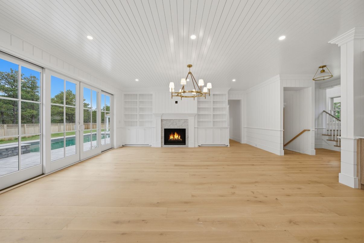 Chandelier, Empty room, Fireplace, Interior, Pendant Lights, Recessed Lighting, Wood Texture Flooring