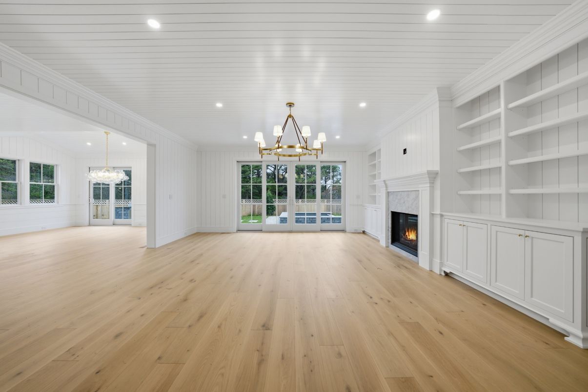Chandelier, Empty room, Fireplace, Interior, Pendant Lights, Recessed Lighting, Wood Texture Flooring