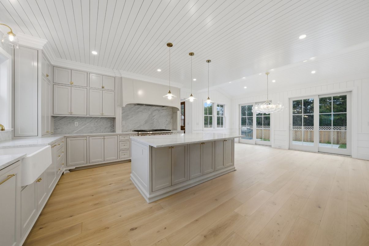 Interior, Kitchen, Marble Walls, Pendant Lights, Recessed Lighting, Stainless Steel Appliances, Wood Texture Flooring