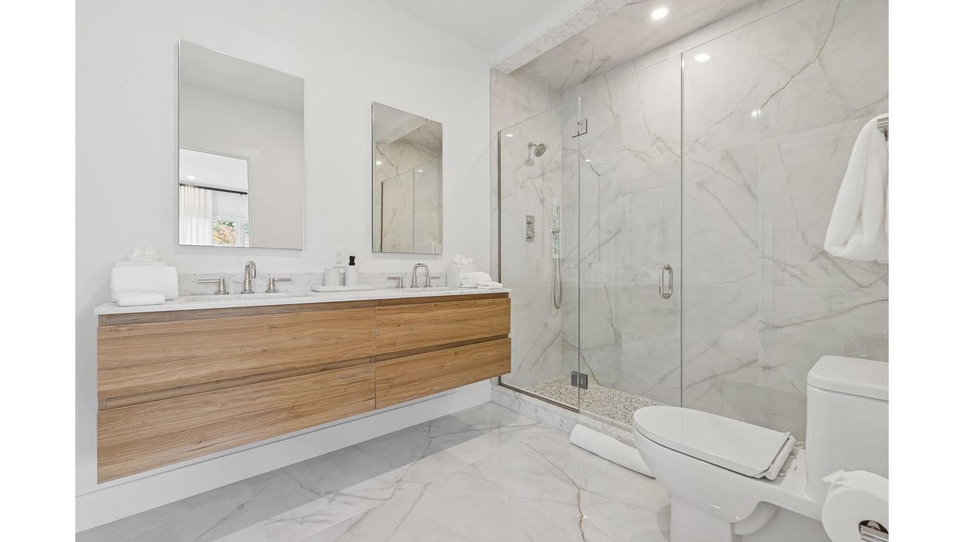 Bathroom, Dual Sink Vanities, Glass Shower, Interior, Marble, Marble Walls, Recessed Lighting