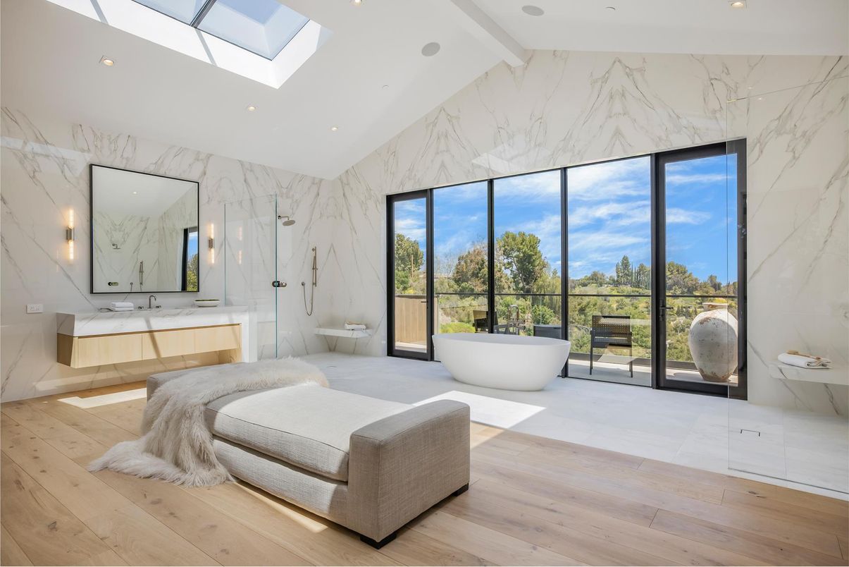 Bathroom, Bedroom, Dual Sink Vanities, Free Standing Baths, Glass Shower, Interior, Marble, Marble Walls, Recessed Lighting, Wood Texture Flooring