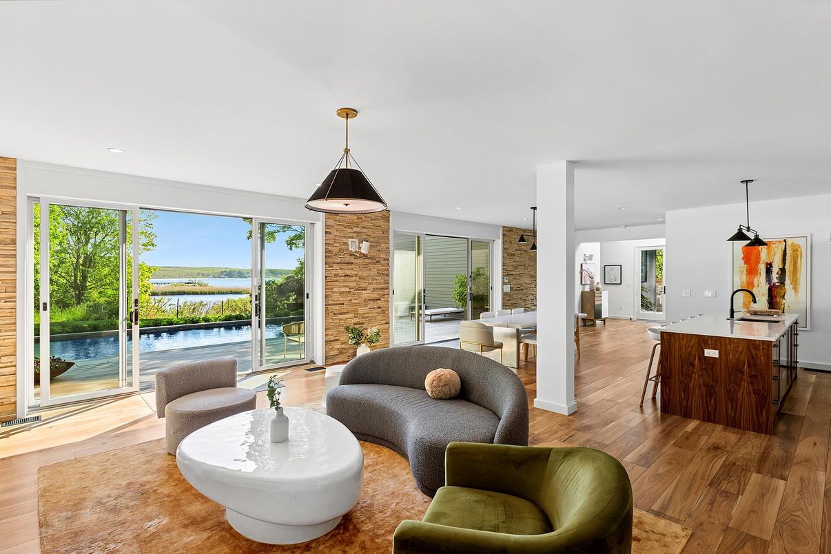 Dining room, Interior, Kitchen, Living room, Pendant Lights, Recessed Lighting, Stone Walls, Water, Wood Texture Flooring