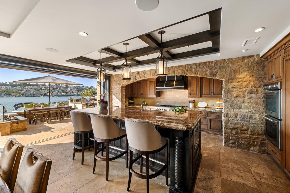 Dining room, Interior, Kitchen, Pendant Lights, Recessed Lighting, Stainless Steel Appliances, Stone Walls, Water, Wooden Beams