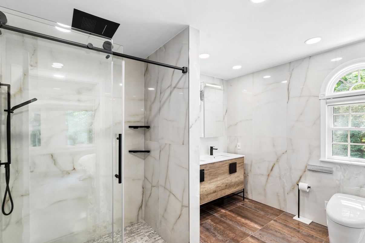 Bathroom, Glass Shower, Interior, Marble Walls, Recessed Lighting, Wood Texture Flooring