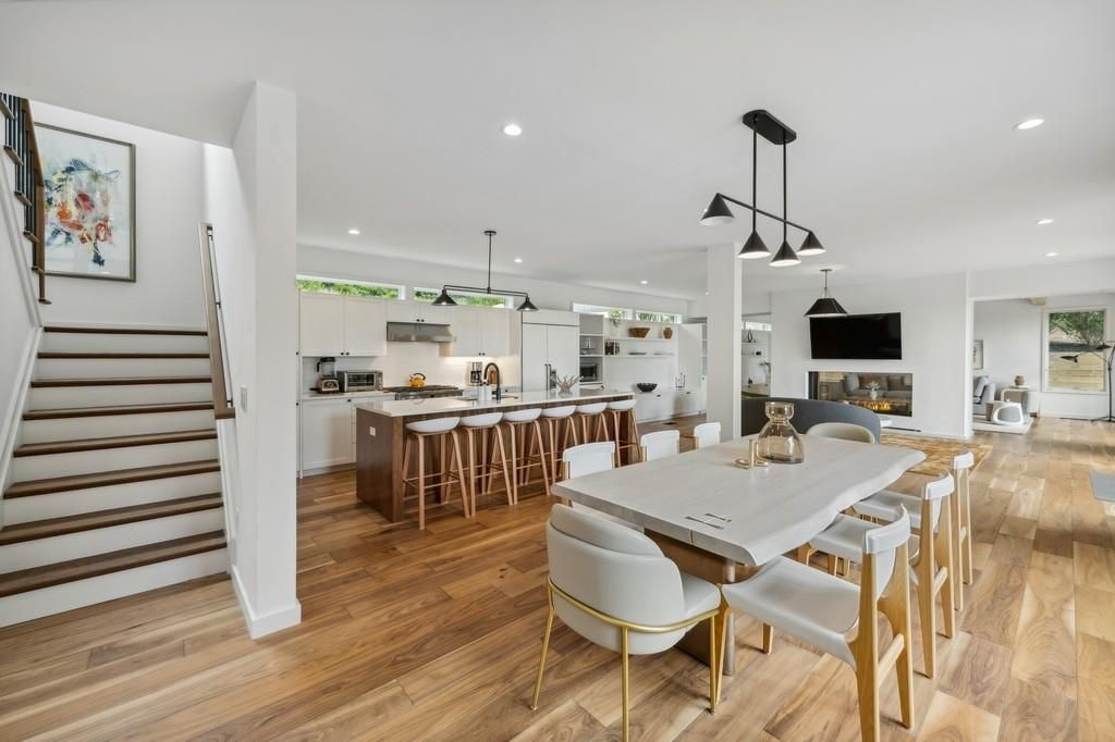 Dining room, Fireplace, Interior, Kitchen, Pendant Lights, Recessed Lighting, Stainless Steel Appliances, Wood Texture Flooring