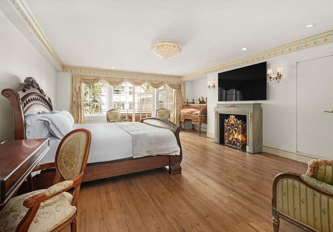 Bedroom, Chandelier, Fireplace, Interior, Recessed Lighting, Wood Texture Flooring