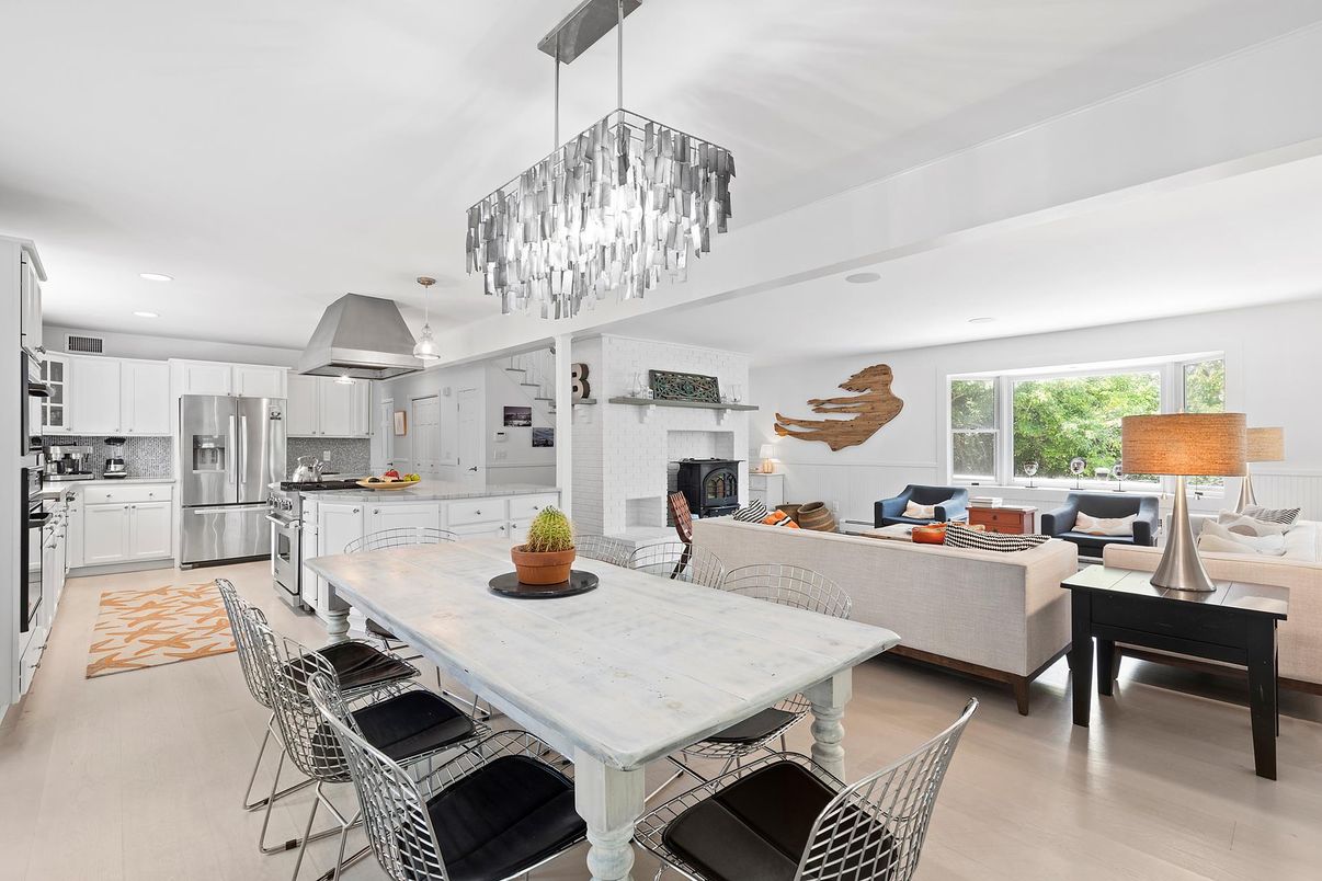 Chandelier, Dining room, Fireplace, Interior, Kitchen, Living room, Recessed Lighting, Stainless Steel Appliances, Wood Texture Flooring