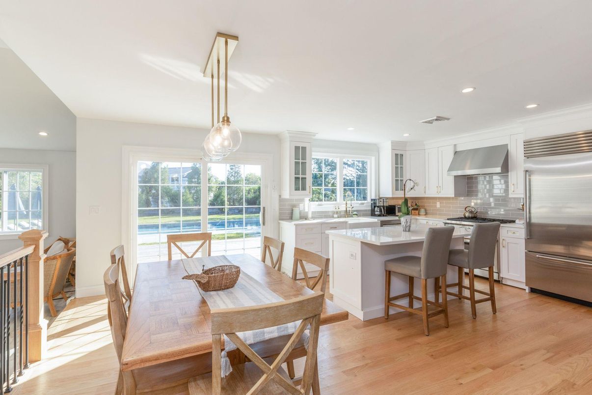 Dining room, Interior, Kitchen, Pendant Lights, Recessed Lighting, Stainless Steel Appliances, Wood Texture Flooring
