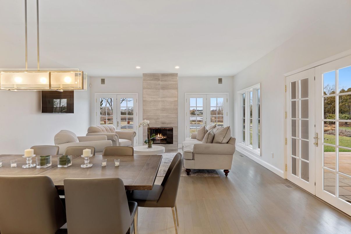 Dining room, Fireplace, Interior, Living room, Pendant Lights, Recessed Lighting, Wood Texture Flooring
