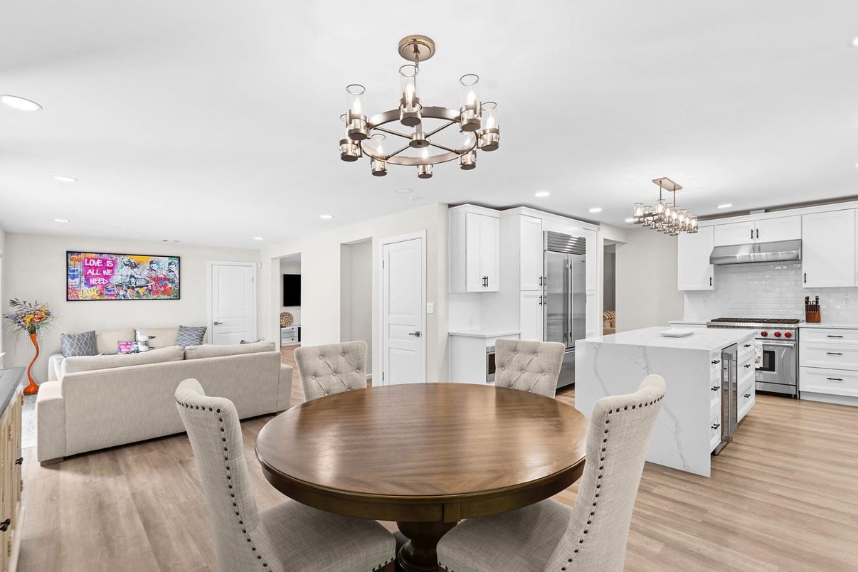 Chandelier, Dining room, Interior, Kitchen, Living room, Pendant Lights, Recessed Lighting, Stainless Steel Appliances, Wood Texture Flooring