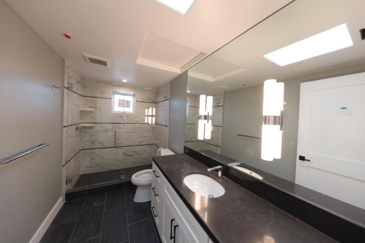 Bathroom, Dual Sink Vanities, Glass Shower, Interior, Marble, Marble Walls, Recessed Lighting