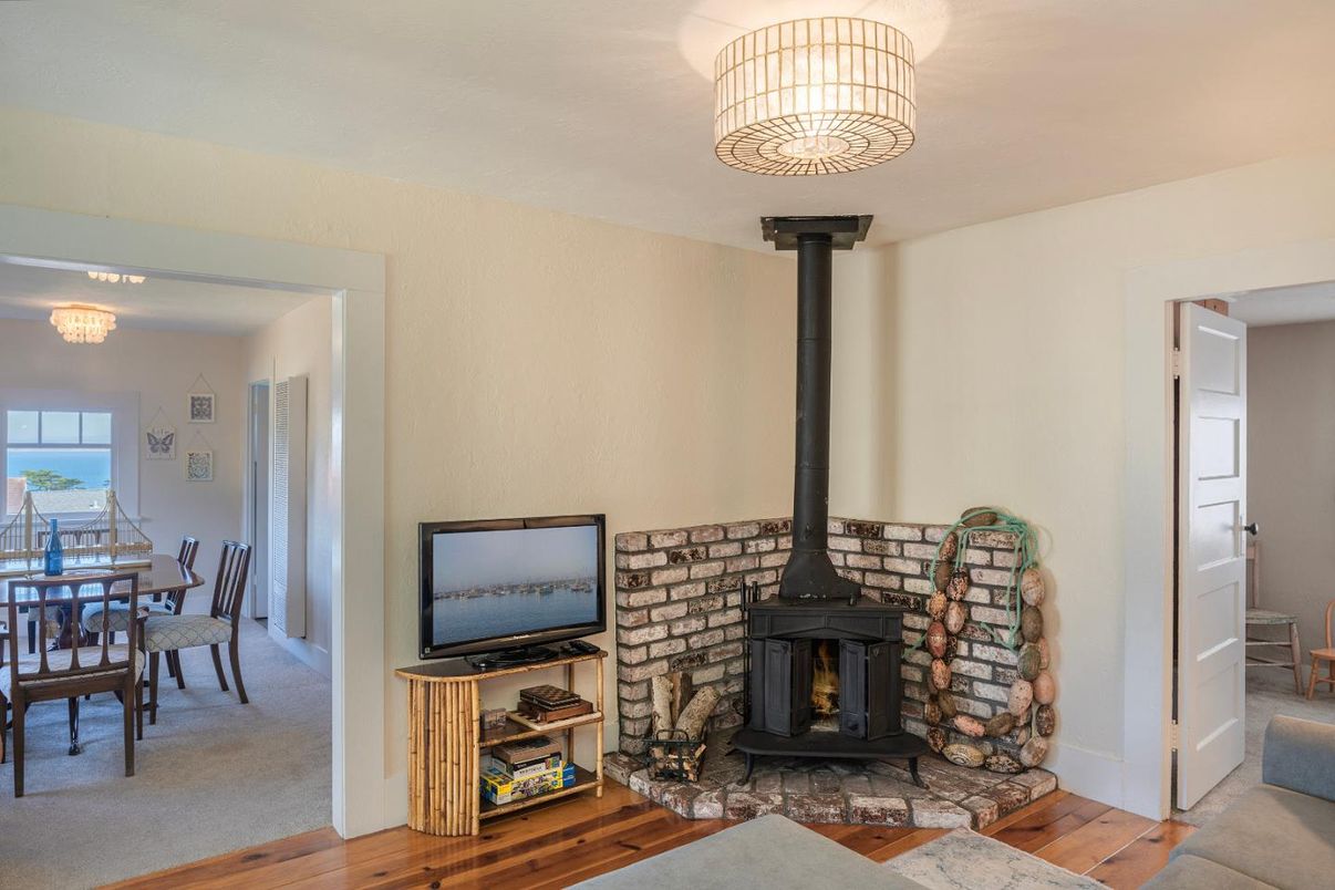 Chandelier, Dining room, Fireplace, Interior, Water, Wood Texture Flooring