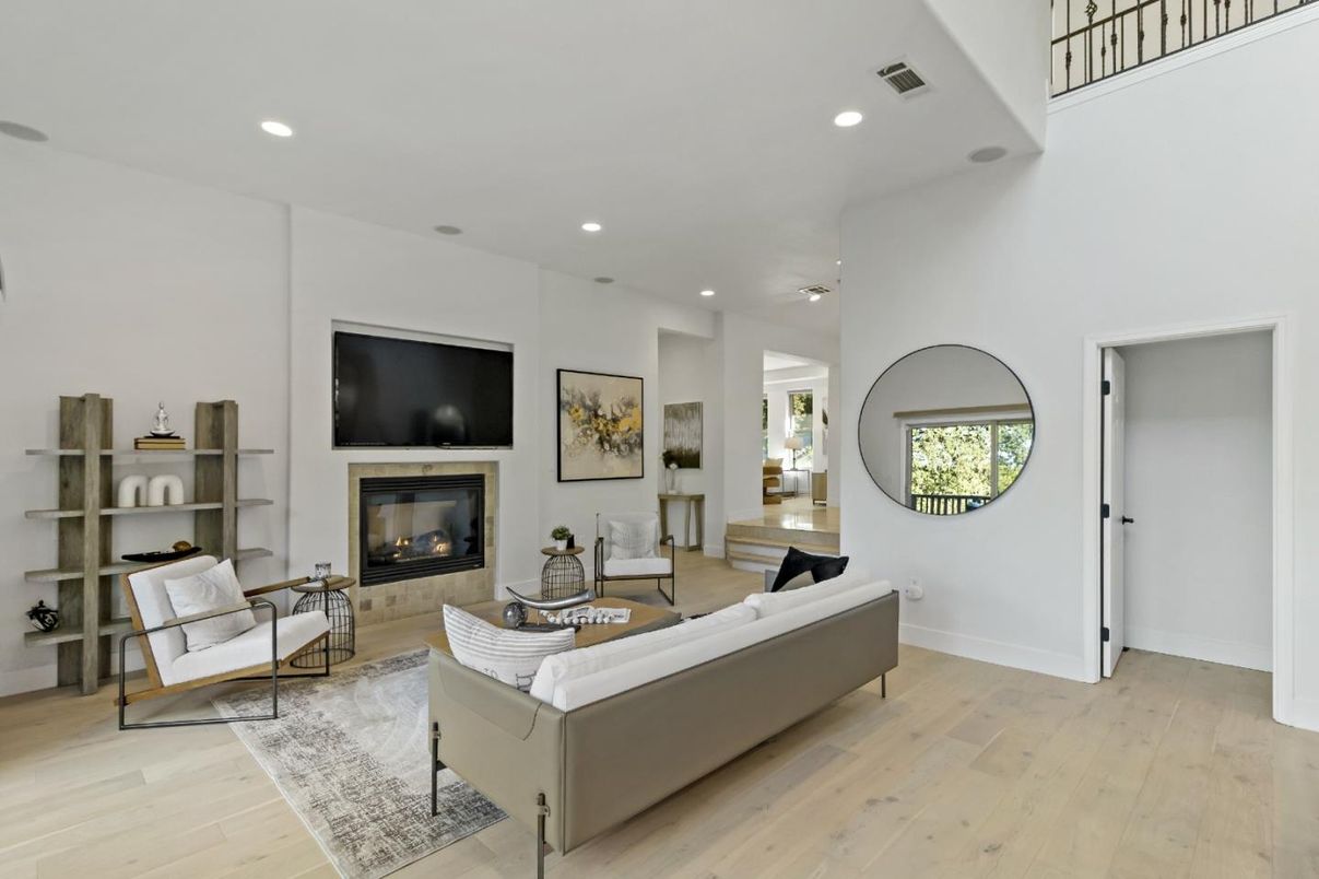 Dining room, Fireplace, Interior, Living room, Recessed Lighting, Wood Texture Flooring