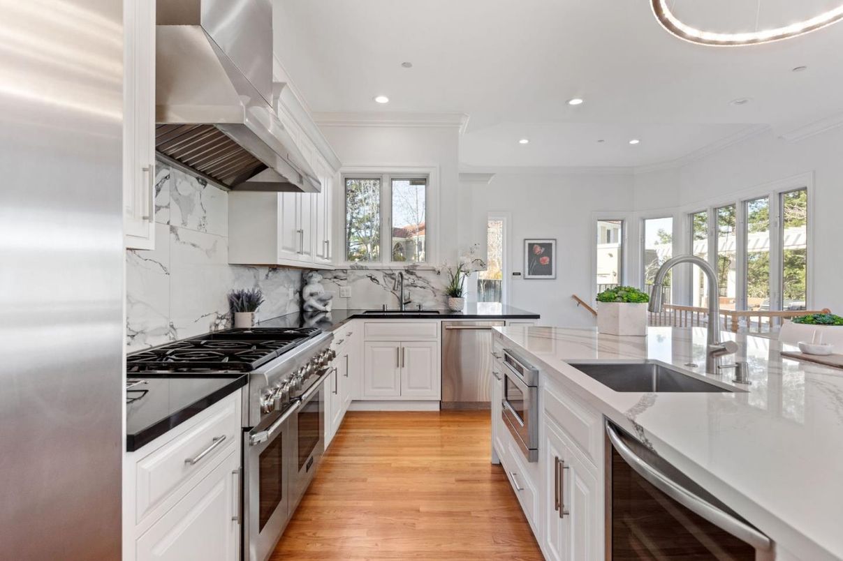 Interior, Kitchen, Marble Walls, Recessed Lighting, Stainless Steel Appliances, Wood Texture Flooring