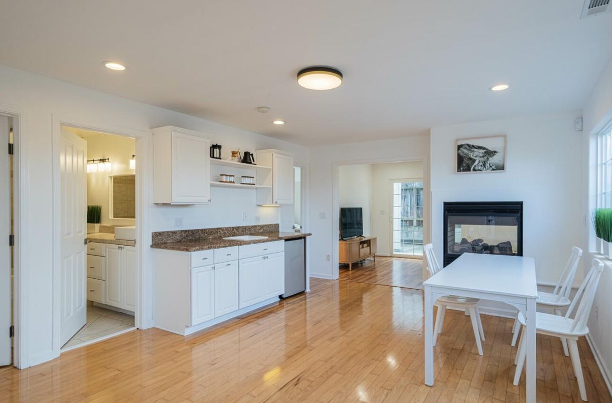 Dining room, Fireplace, Interior, Kitchen, Recessed Lighting, Wood Texture Flooring