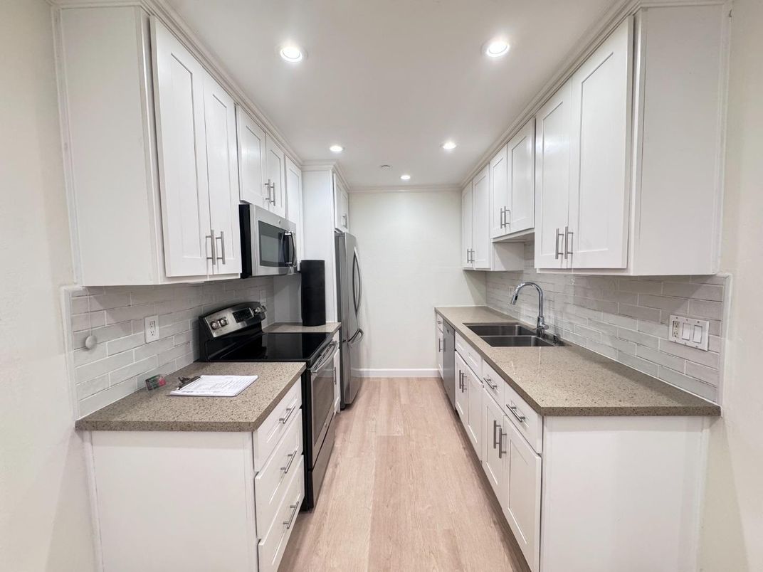 Bathroom, Dual Sink Vanities, Glass Shower, Interior, Recessed Lighting, Wood Texture Flooring