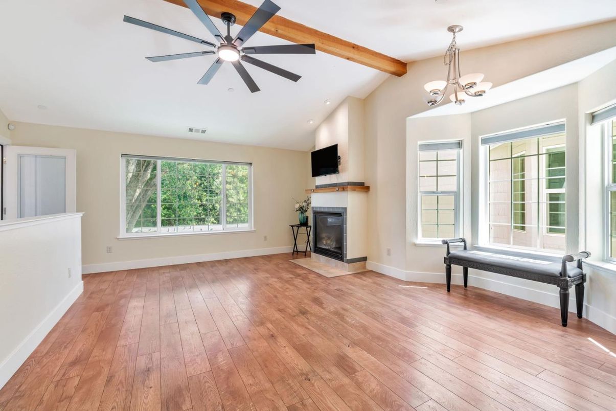 Chandelier, Empty room, Fireplace, Interior, Recessed Lighting, Wooden Beams, Wood Texture Flooring