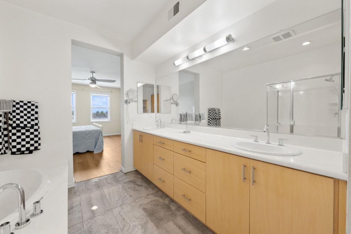 Bathroom, Dual Sink Vanities, Glass Shower, Interior, Recessed Lighting, Wood Texture Flooring