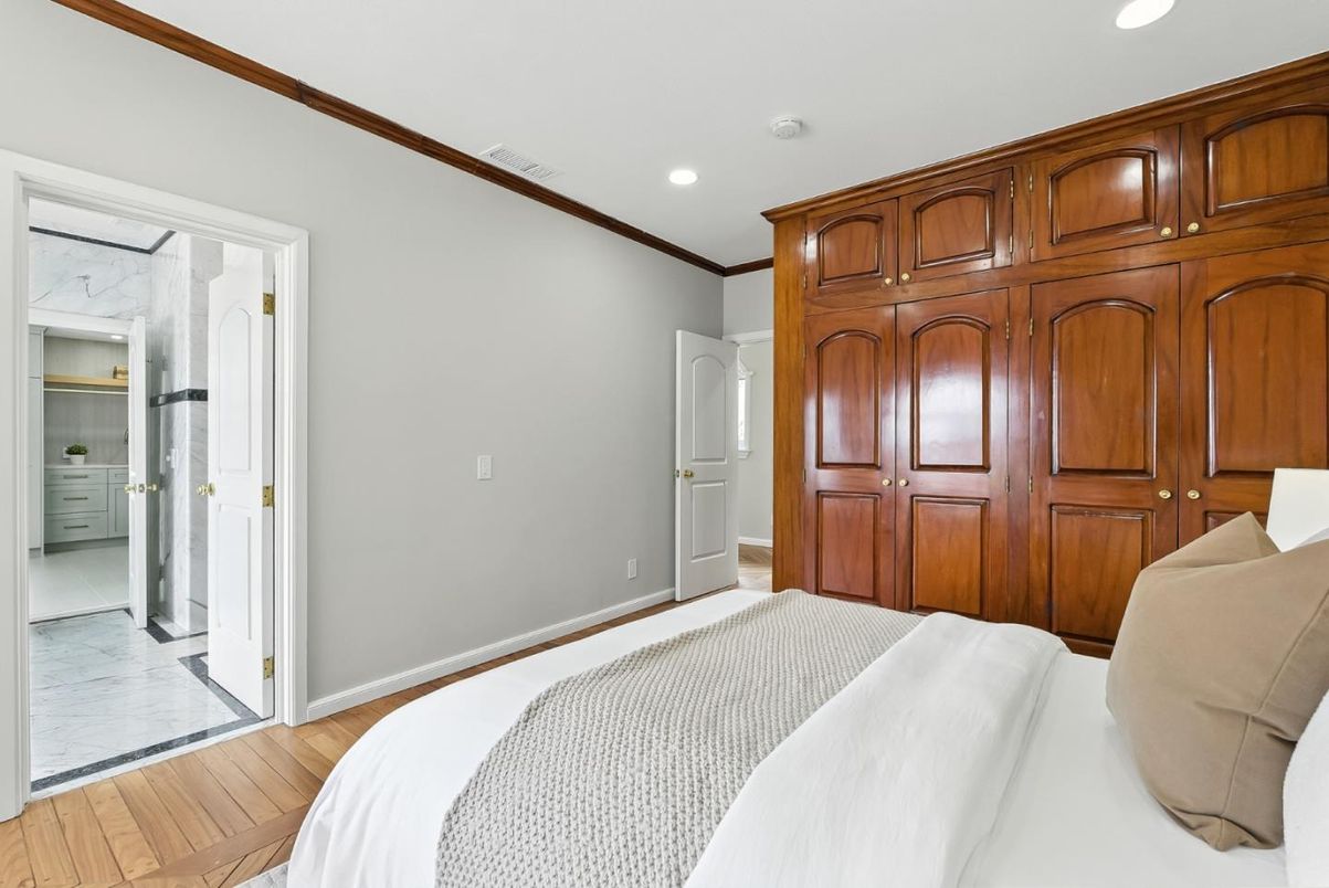 Bathroom, Dual Sink Vanities, Glass Shower, Interior, Marble, Marble Walls, Recessed Lighting