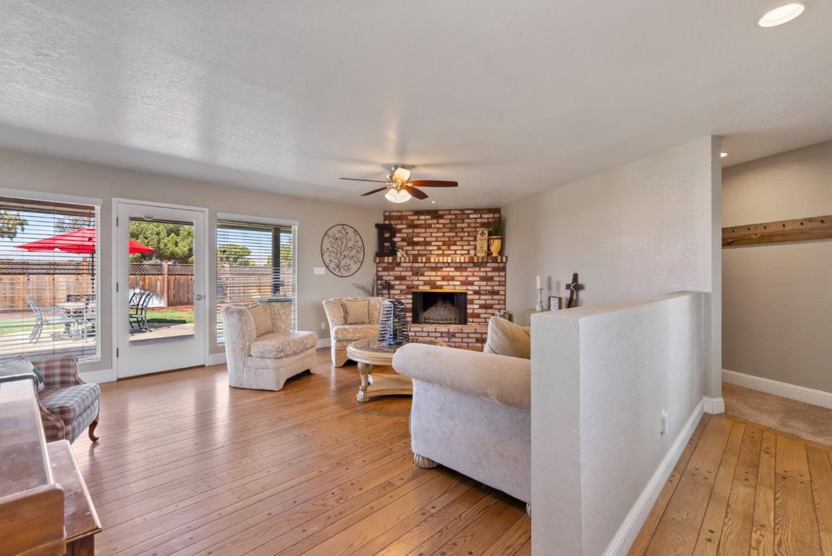 Fireplace, Interior, Living room, Recessed Lighting, Stone Walls, Wood Texture Flooring