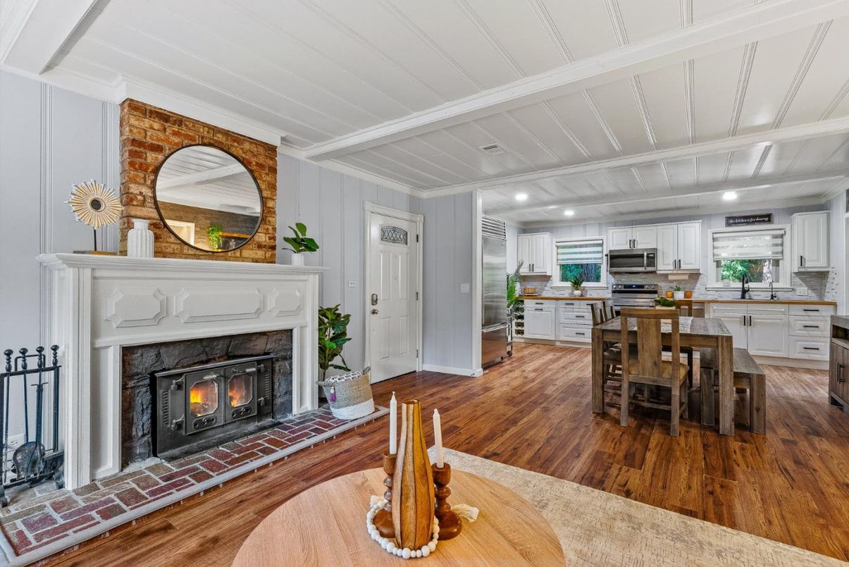 Dining room, Fireplace, Interior, Kitchen, Recessed Lighting, Stainless Steel Appliances, Wood Texture Flooring