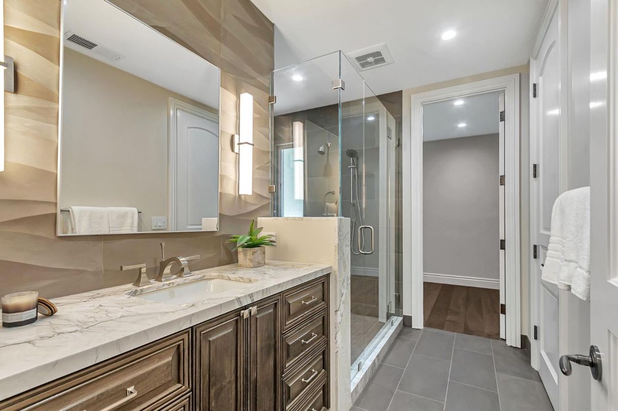 Bathroom, Dual Sink Vanities, Glass Shower, Interior, Recessed Lighting, Wood Texture Flooring