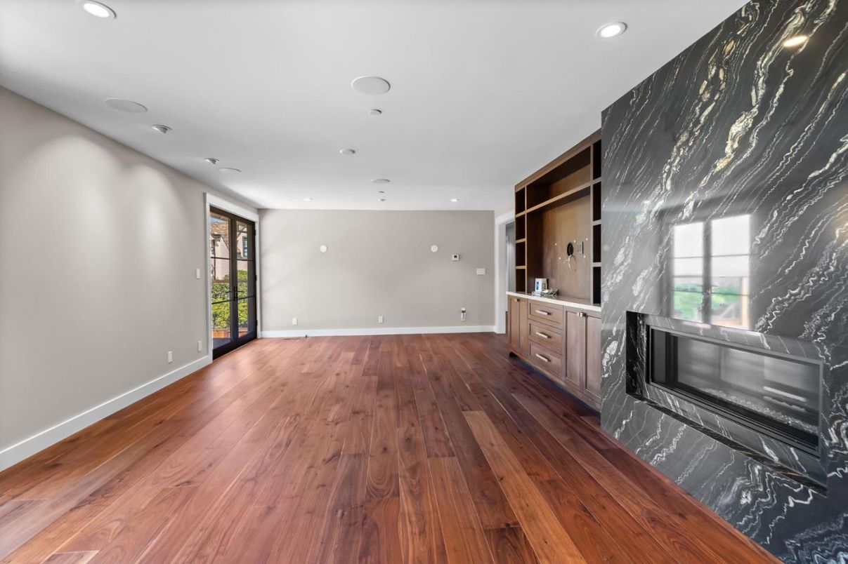 Empty room, Fireplace, Interior, Marble Walls, Recessed Lighting, Wood Texture Flooring