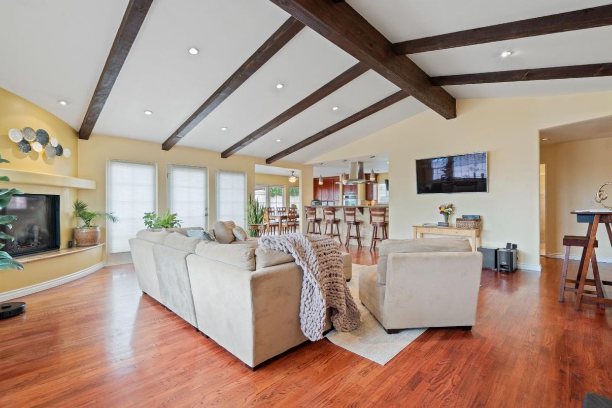 Dining room, Fireplace, Interior, Living room, Recessed Lighting, Wooden Beams, Wood Texture Flooring