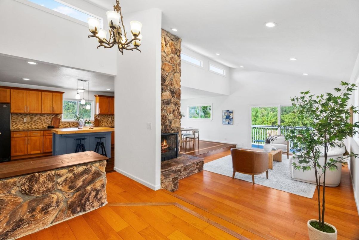 Chandelier, Fireplace, Interior, Kitchen, Living room, Pendant Lights, Recessed Lighting, Wood Texture Flooring