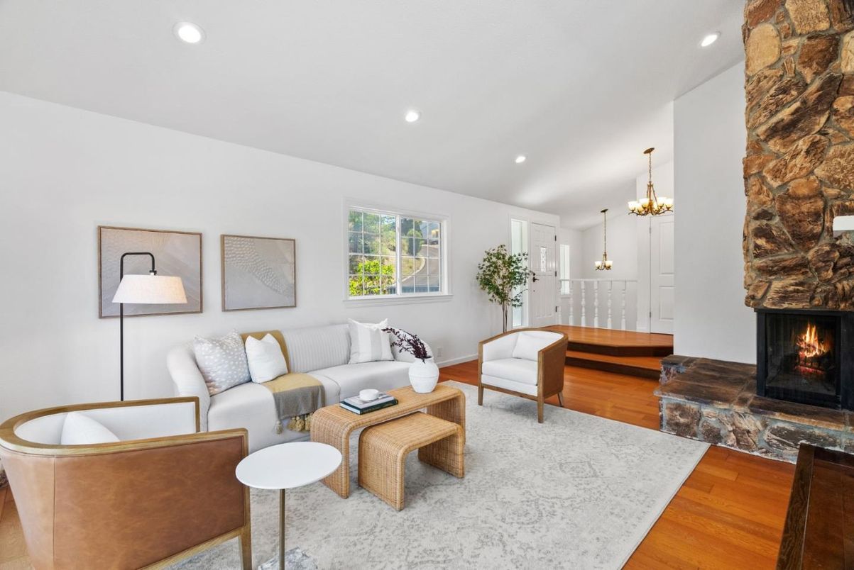 Chandelier, Fireplace, Interior, Living room, Pendant Lights, Recessed Lighting, Stone Walls, Wood Texture Flooring