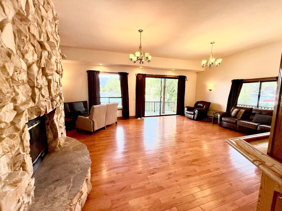 Chandelier, Fireplace, Interior, Living room, Stone Walls, Wood Texture Flooring