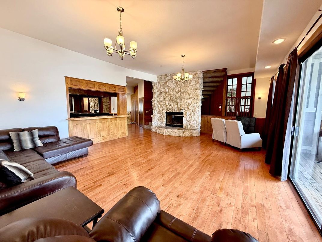 Chandelier, Fireplace, Interior, Living room, Recessed Lighting, Wood Texture Flooring